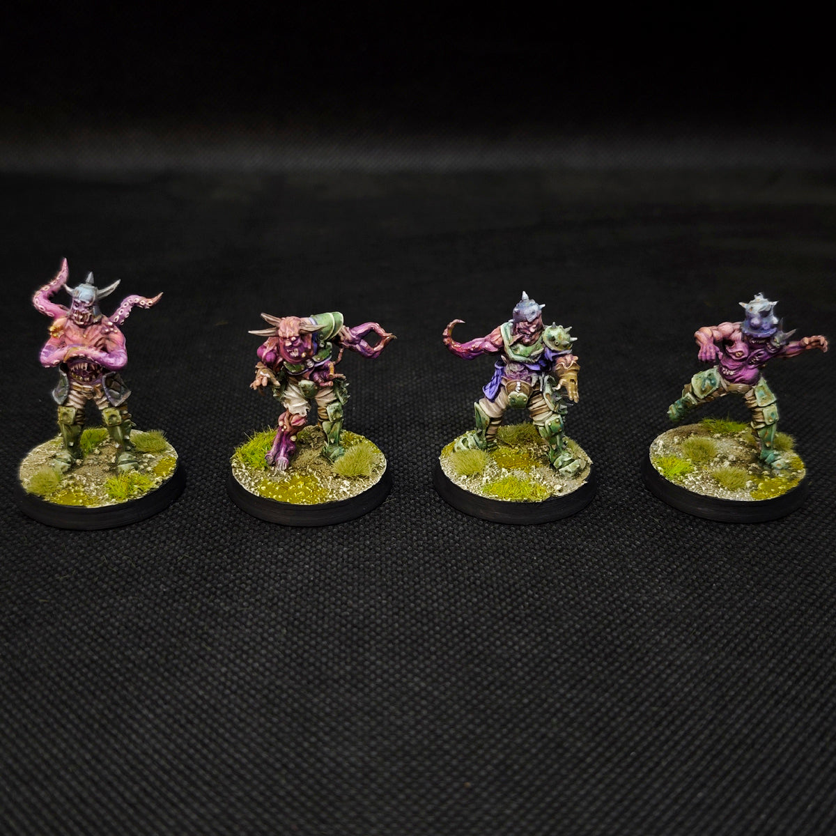 Fantasy football tabletop miniatures featuring Rottens from the Plague Chaos Team in dynamic poses.