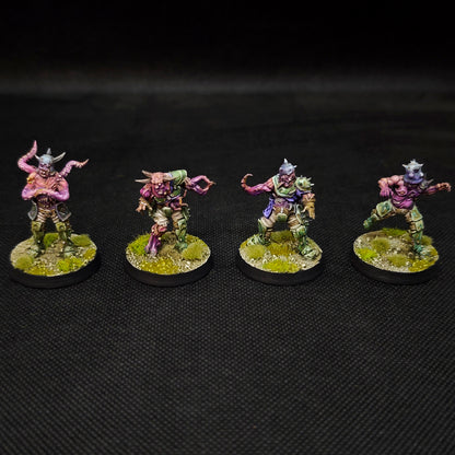 Fantasy football tabletop miniatures featuring Rottens from the Plague Chaos Team in dynamic poses.